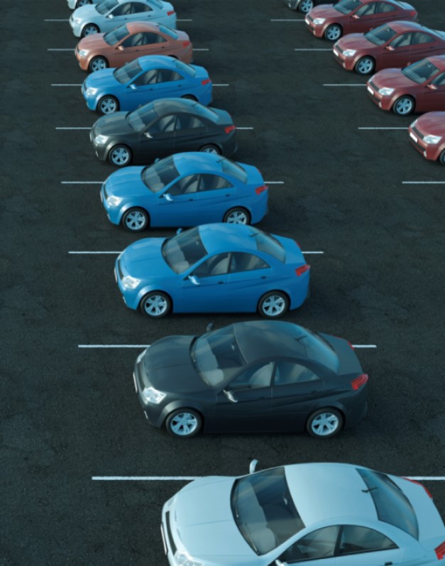 An image of a full car park is combined with a KINTO Join screen to promote employee carpooling as means to reducing carpark demands.
